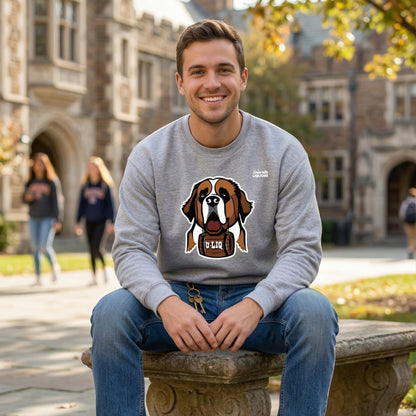 Man sitting on a stone bench in front of a building wearing a gray University Liquors sweatshirt