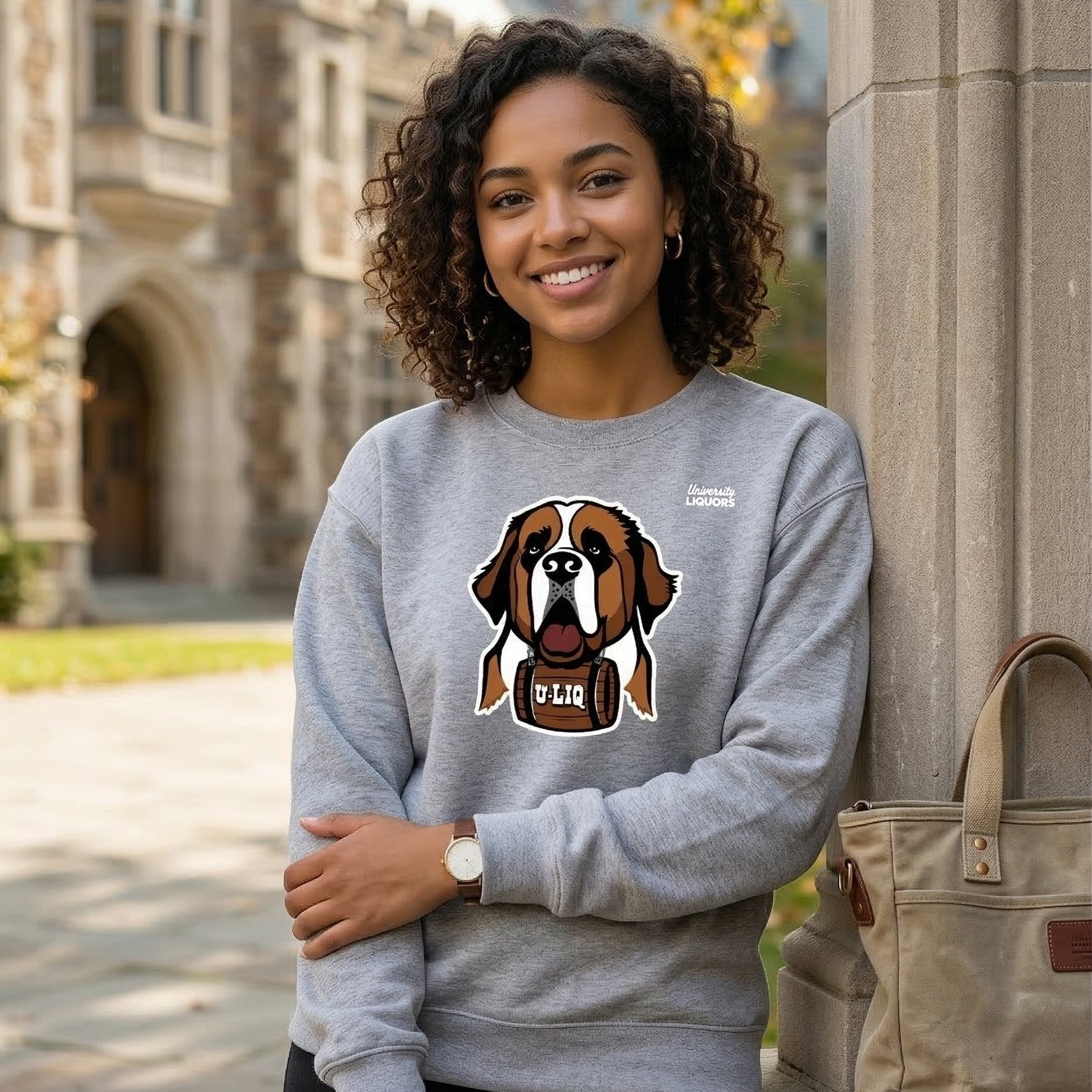 Woman wearing a gray University Liquors sweatshirt in front of a building