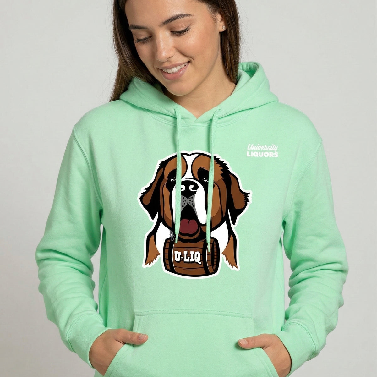 Person wearing a mint green University Liquors hoodie.