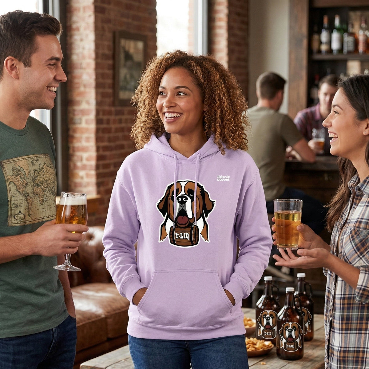 Three people in a bar setting, two holding drinks and one wearing a orchid University Liquors hoodie.
